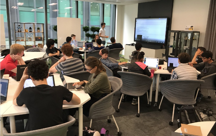 25 teens learning about AI at boot camp