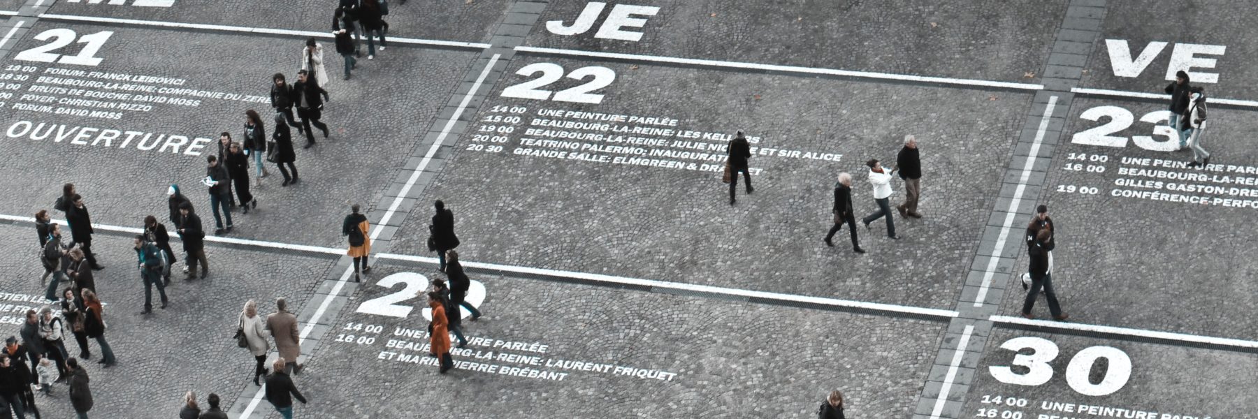 people walking on pavement