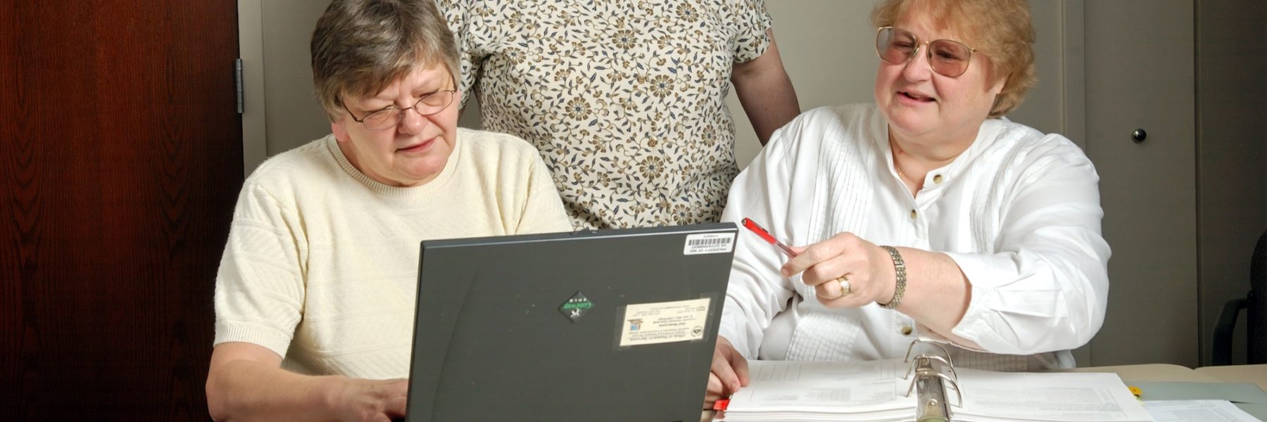 three women on laptop